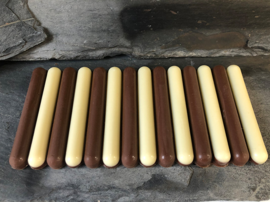 Bar with rotating strips of white and milk chocolate.